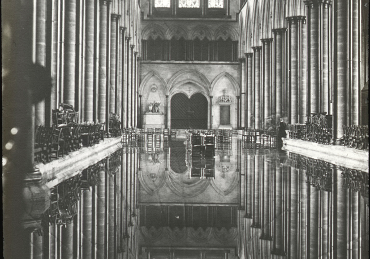 Black and white photo showing a flooded nave inside Salisbury Cathedral