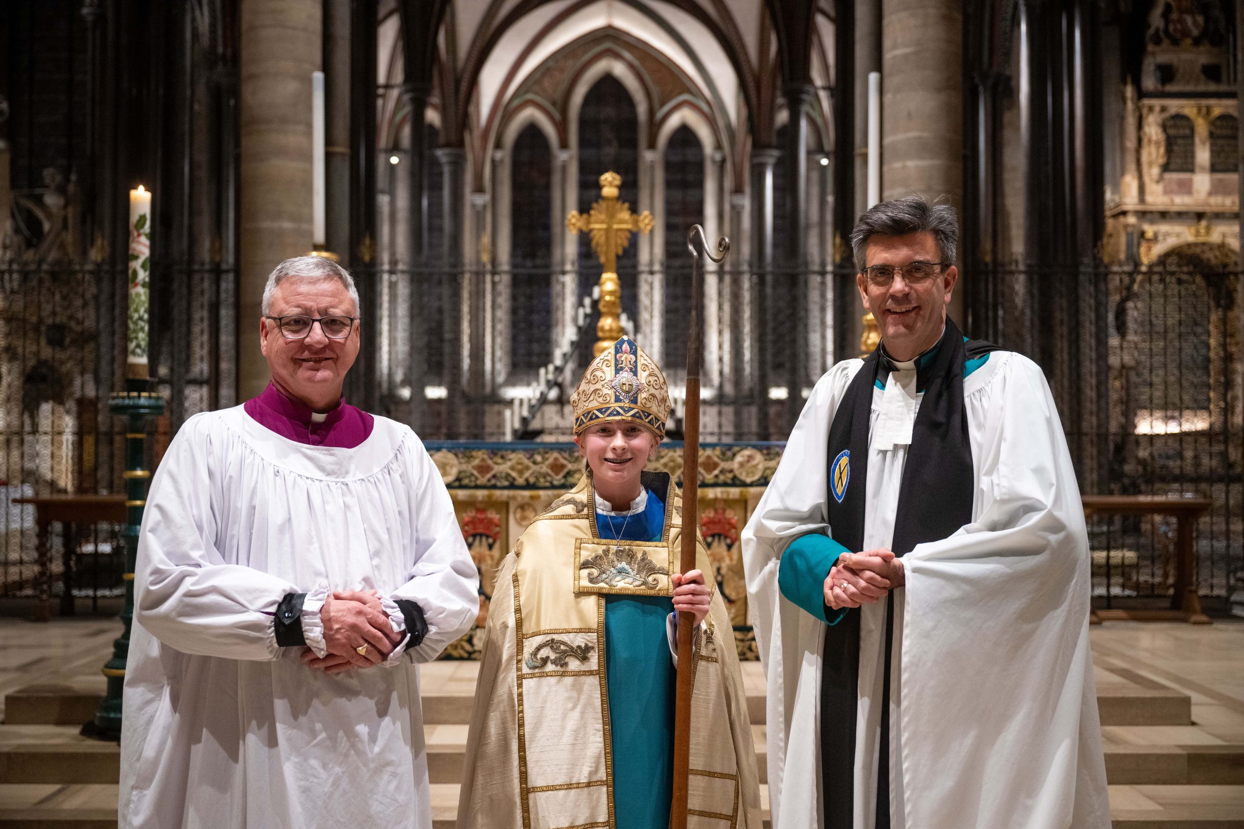 The Right Revd Stephen Lake Bishop of Salisbury, Chorister Bishop Emmie Piper, and The Very Revd Nicholas Papadopulos, Dean of Salisbury