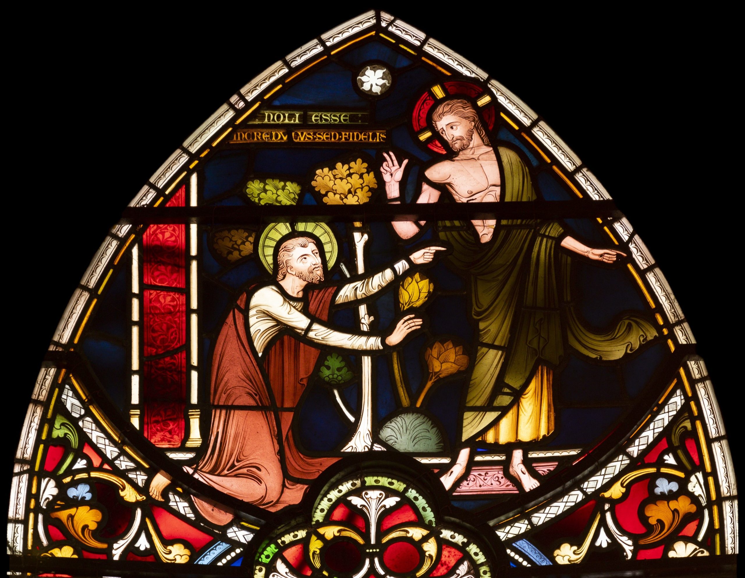 Stained glass window shows Jesus and St Thomas