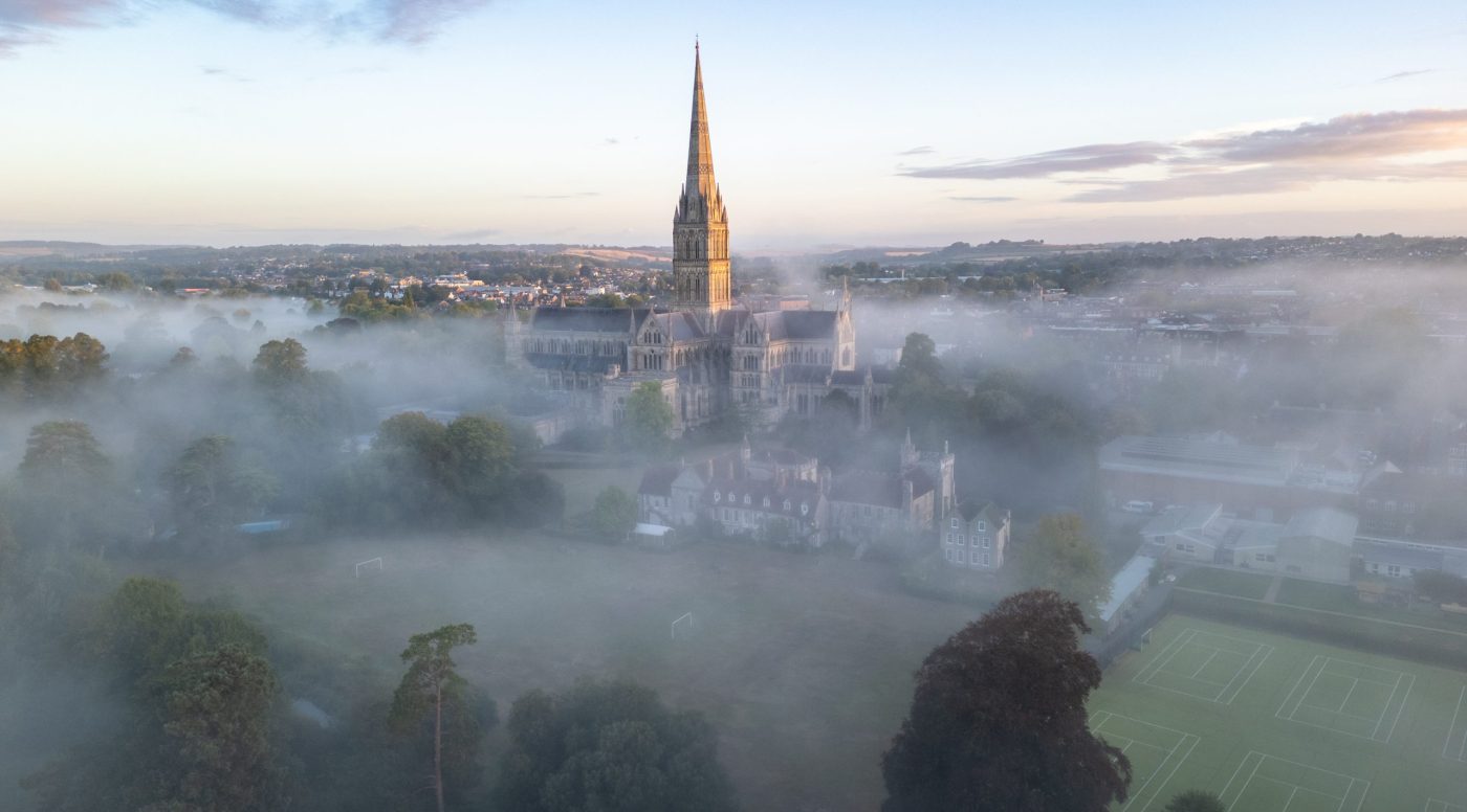 View of Cathedral from the South East, with the spire rising clear above an early morning mist.